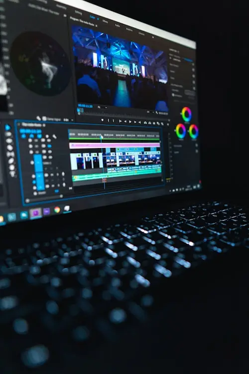Video editor working on color grading and post-production in a professional editing suite